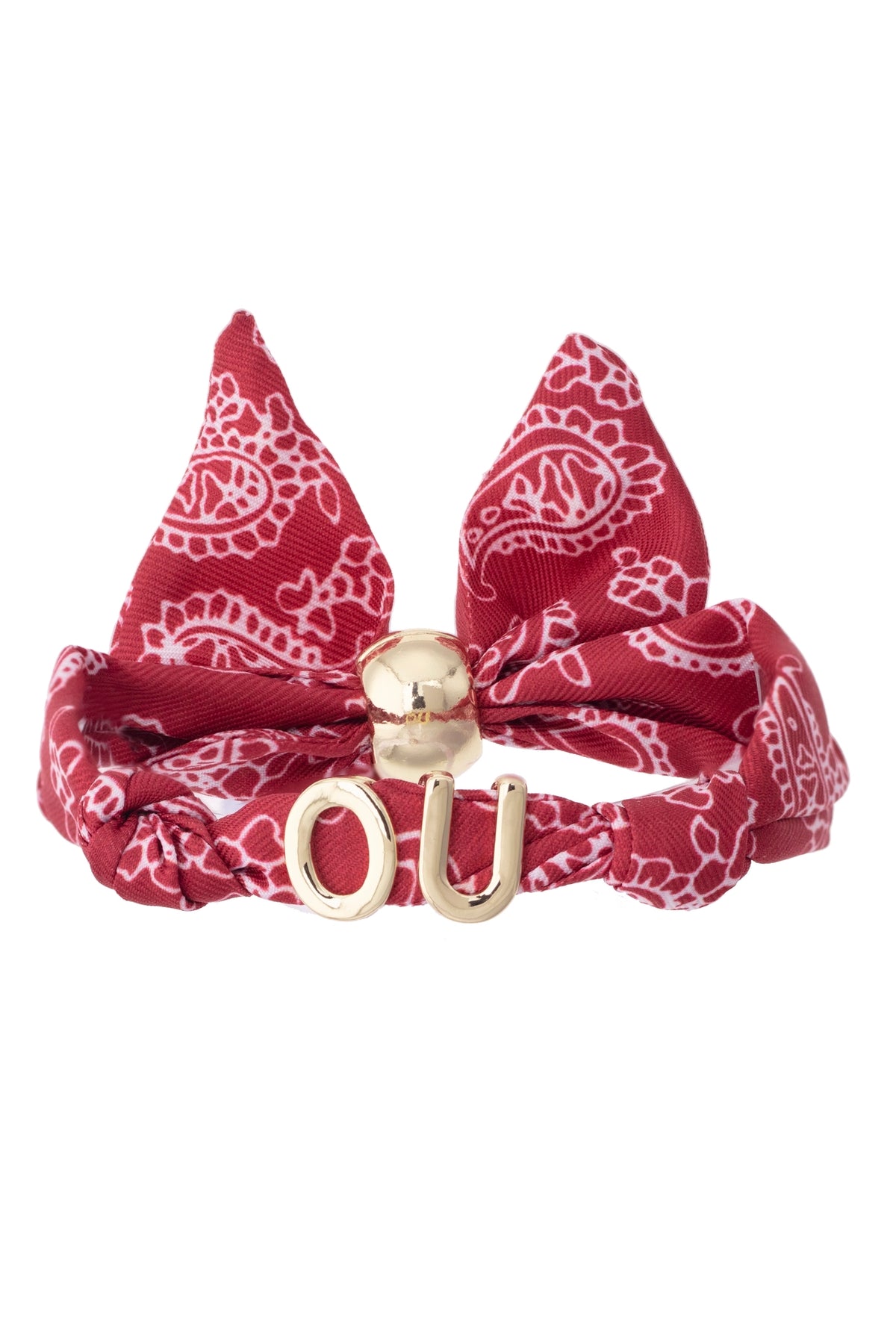 A red and white paisley bandana bow headband with a gold metal 'OU' initial charm, displayed on a clean white background.