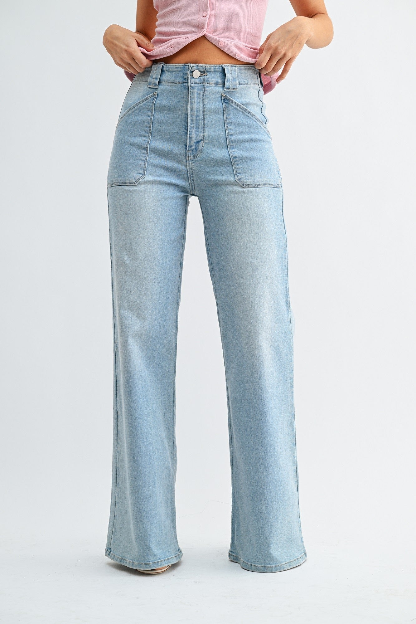 Light blue jeans worn by a person on a white background