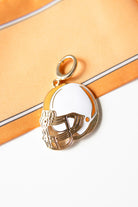 white and orange helmet-shaped pendant