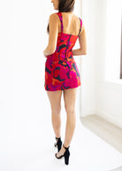 Woman wearing a colorful dress with a white background