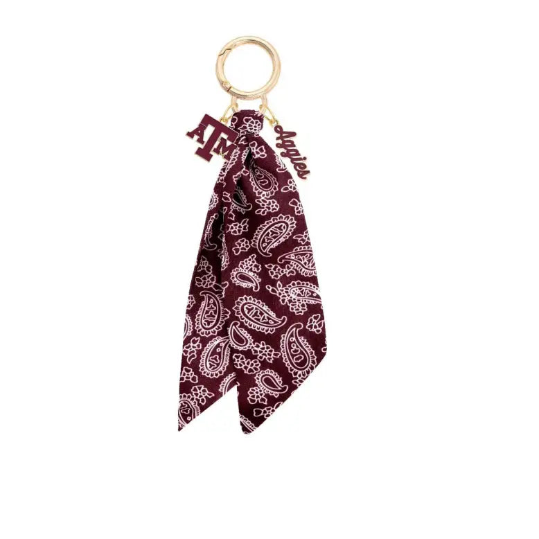 Maroon bandana keychain with paisley pattern on a white background