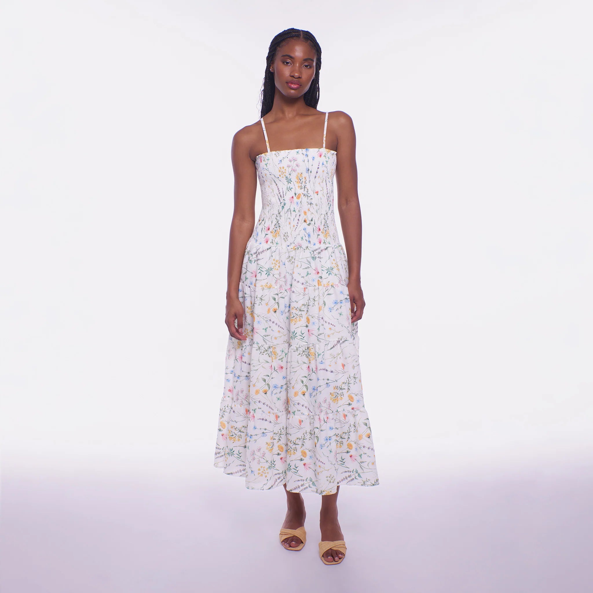 Woman wearing a floral dress on a white background