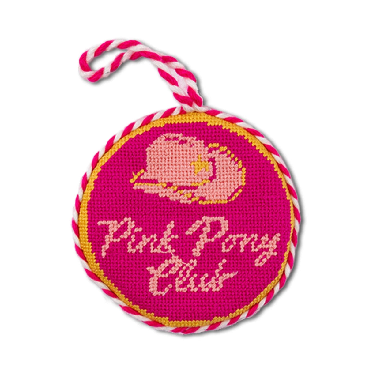 Pink round needlepoint ornament with cowboy hat design and 'Pink Pony Club' text on a white background