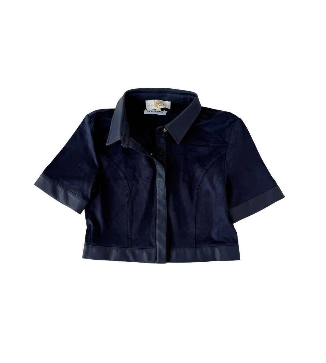 A cropped short-sleeve button-up shirt in dark navy blue, featuring contrast dark satin-like trim along the collar, cuffs, and hem, displayed against a solid white background.