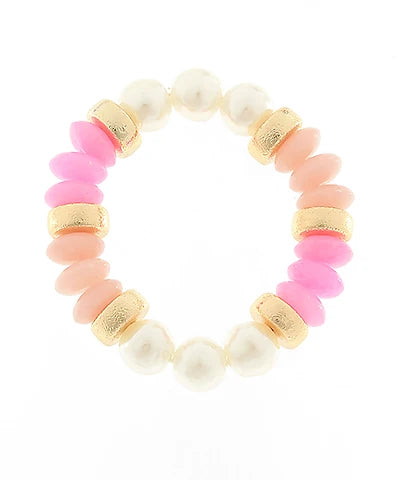 Bracelet with pink and white beads and gold accents on a white background