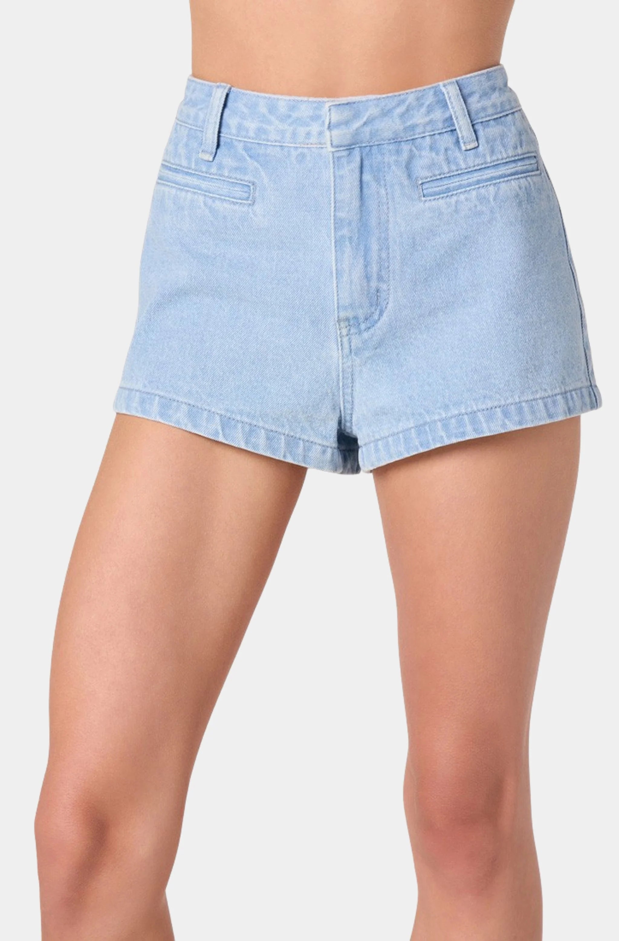 Light blue denim shorts worn by a person on a plain background