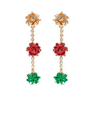 Pair of earrings with red and green gemstones on a white background