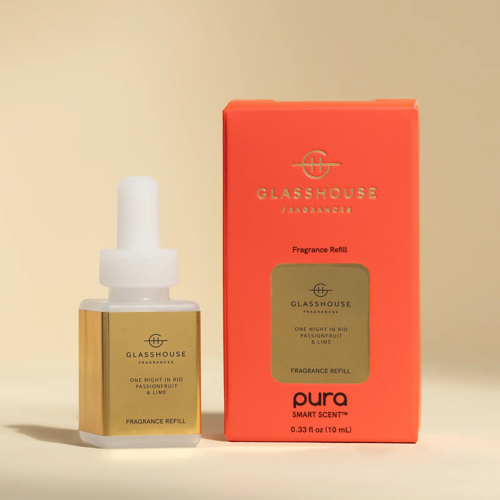 Glasshouse Fragrances bottle and packaging on a beige background