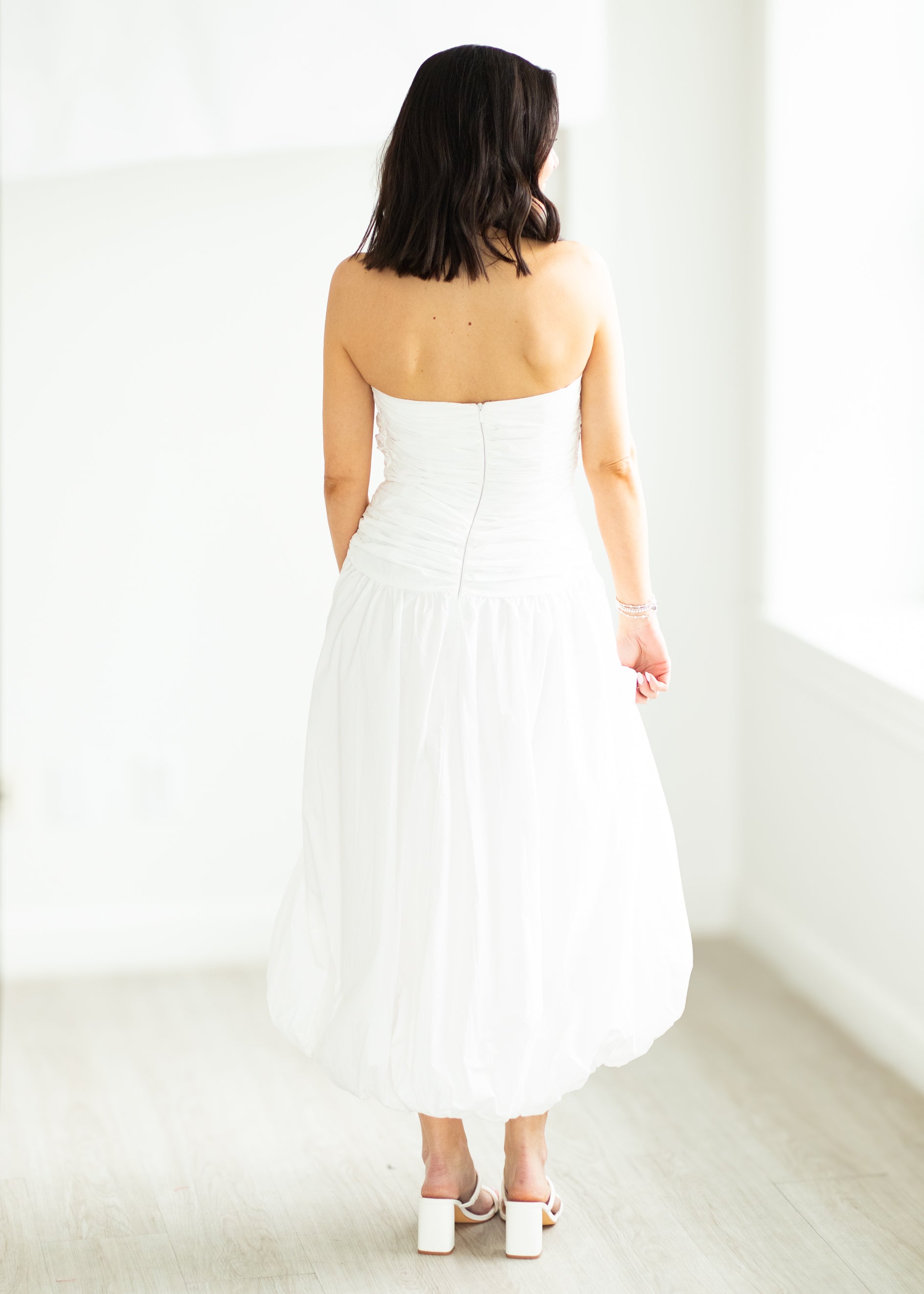 woman wearing white dress