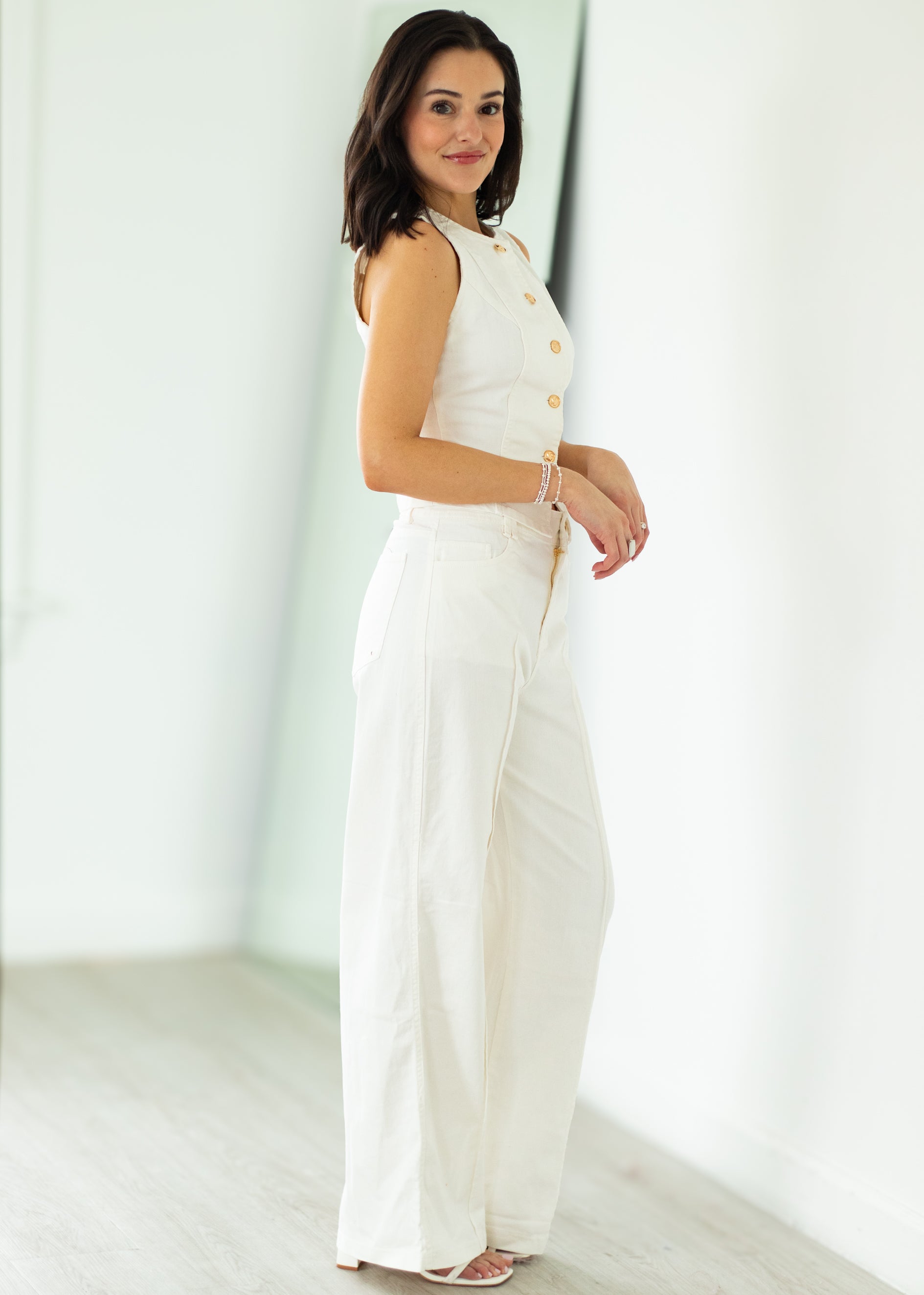 woman wearing white denim outfit