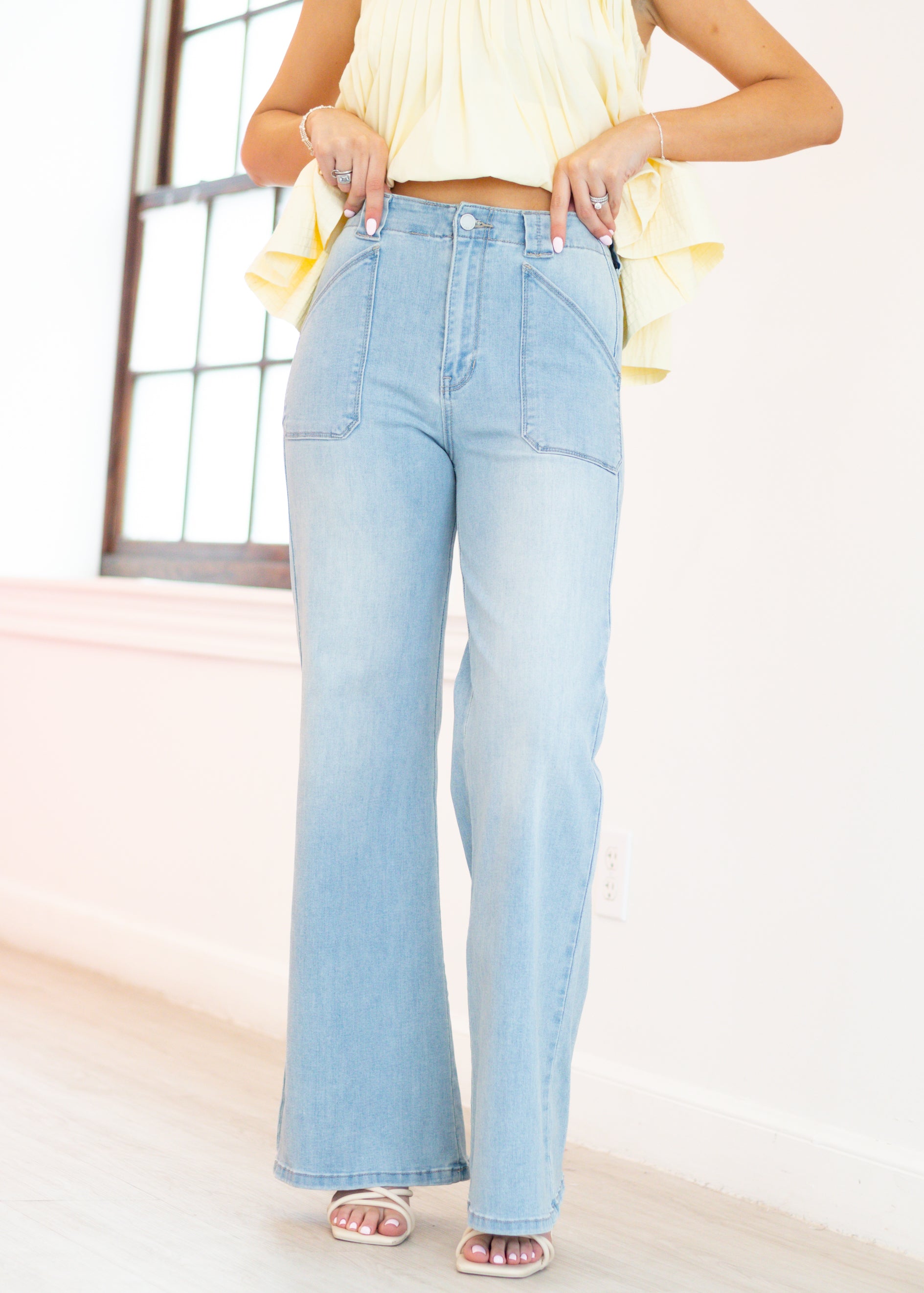 Light blue jeans worn by a person with a neutral background