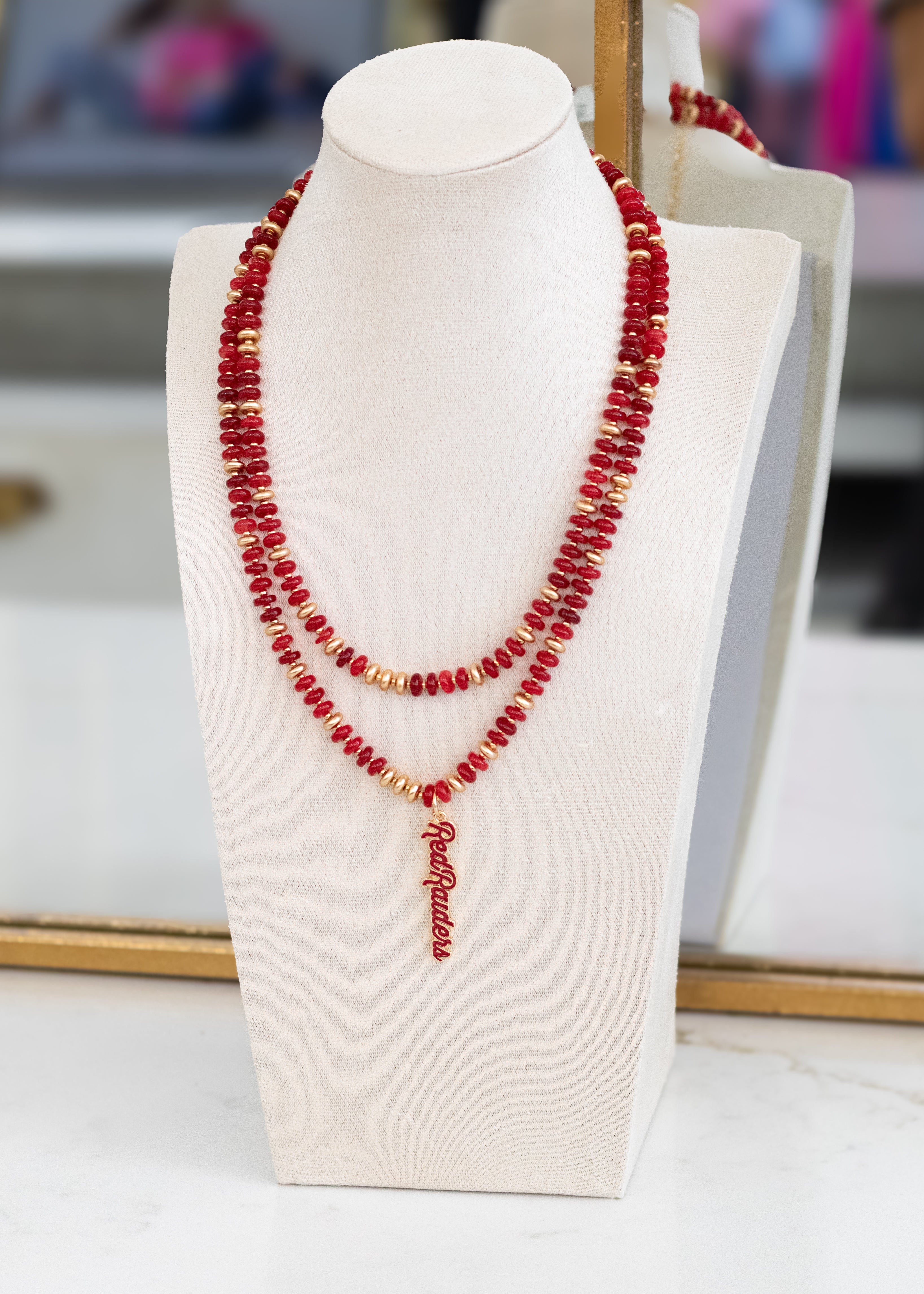 Red and gold beaded necklace with Texas Tech Red Raiders pendant