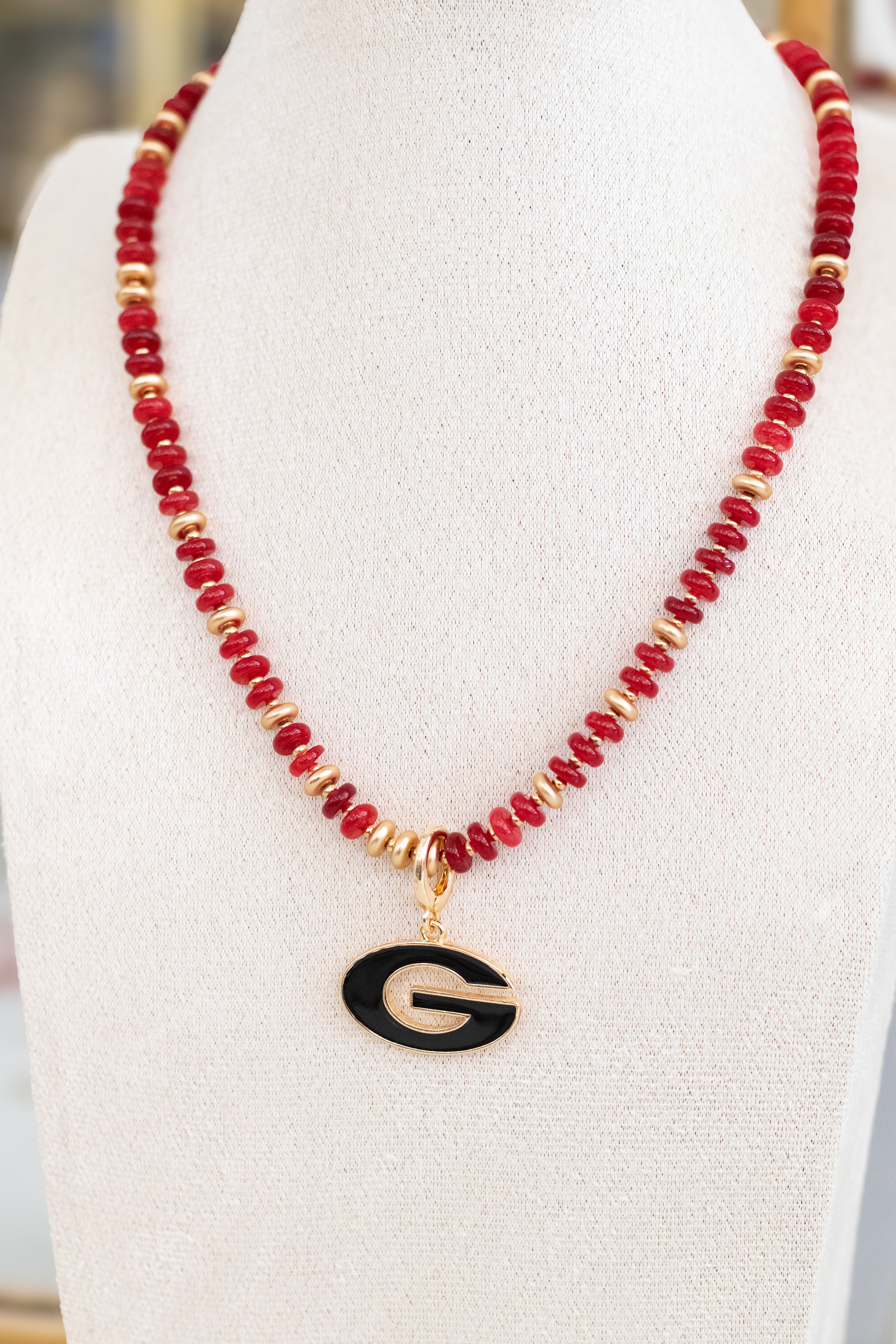 Red and gold beaded necklace with Georgia pendant