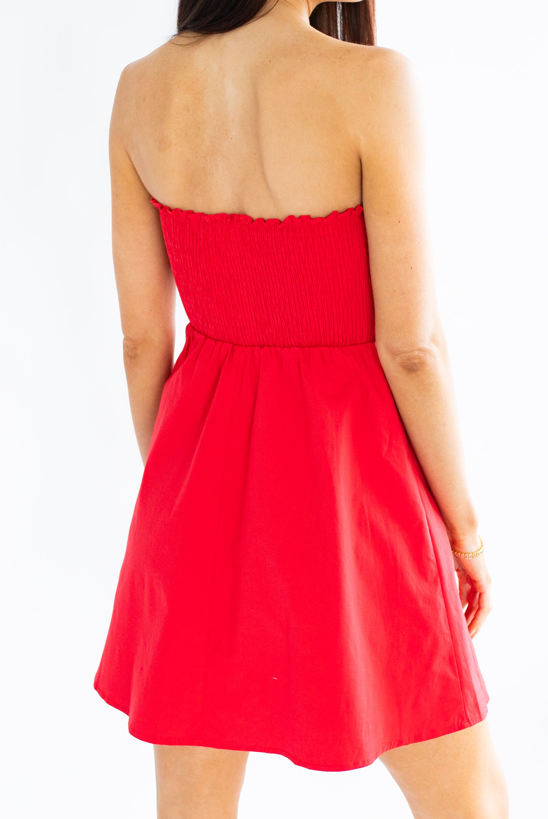 Red strapless dress on a white background