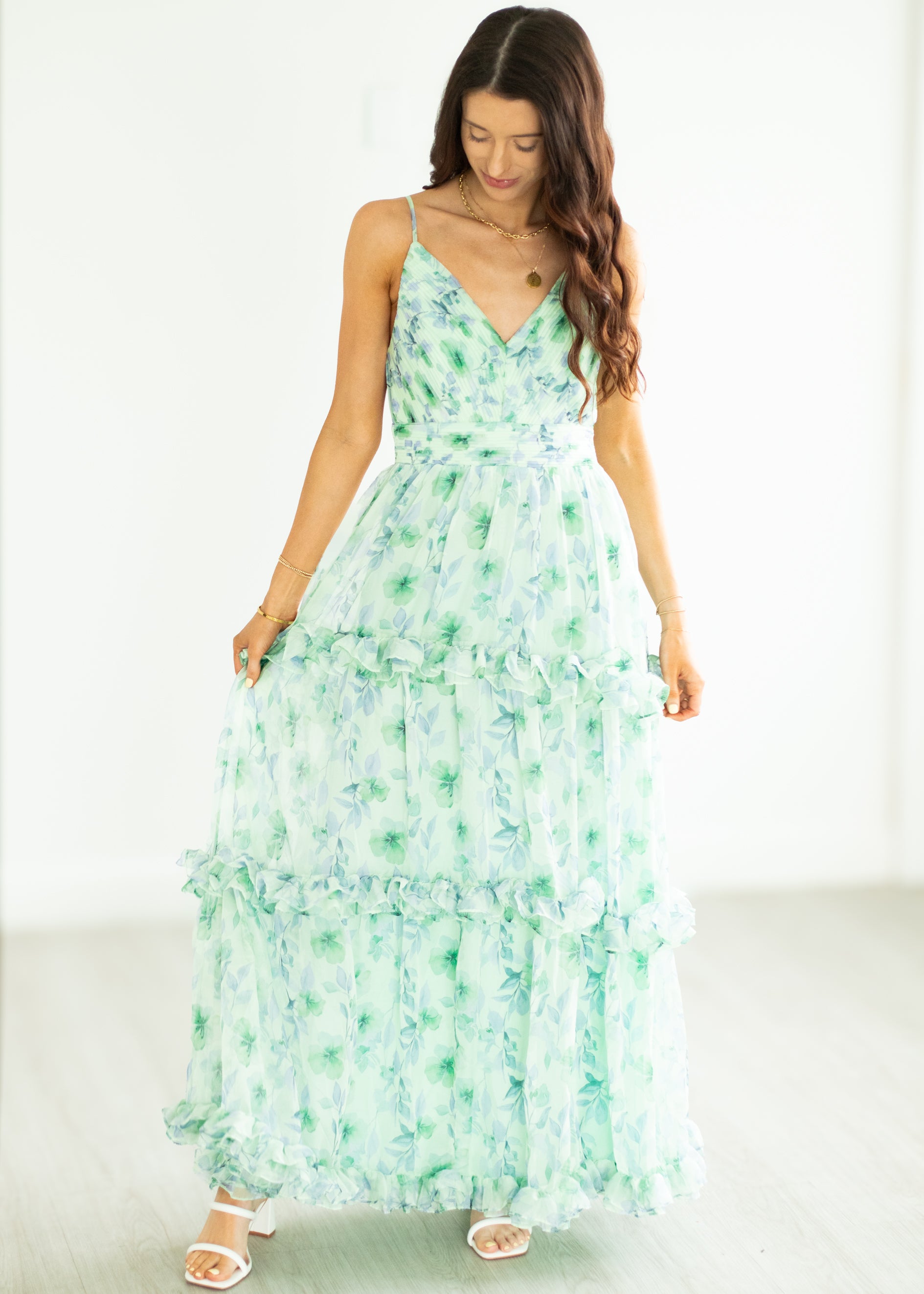 Woman wearing a floral dress on a white background