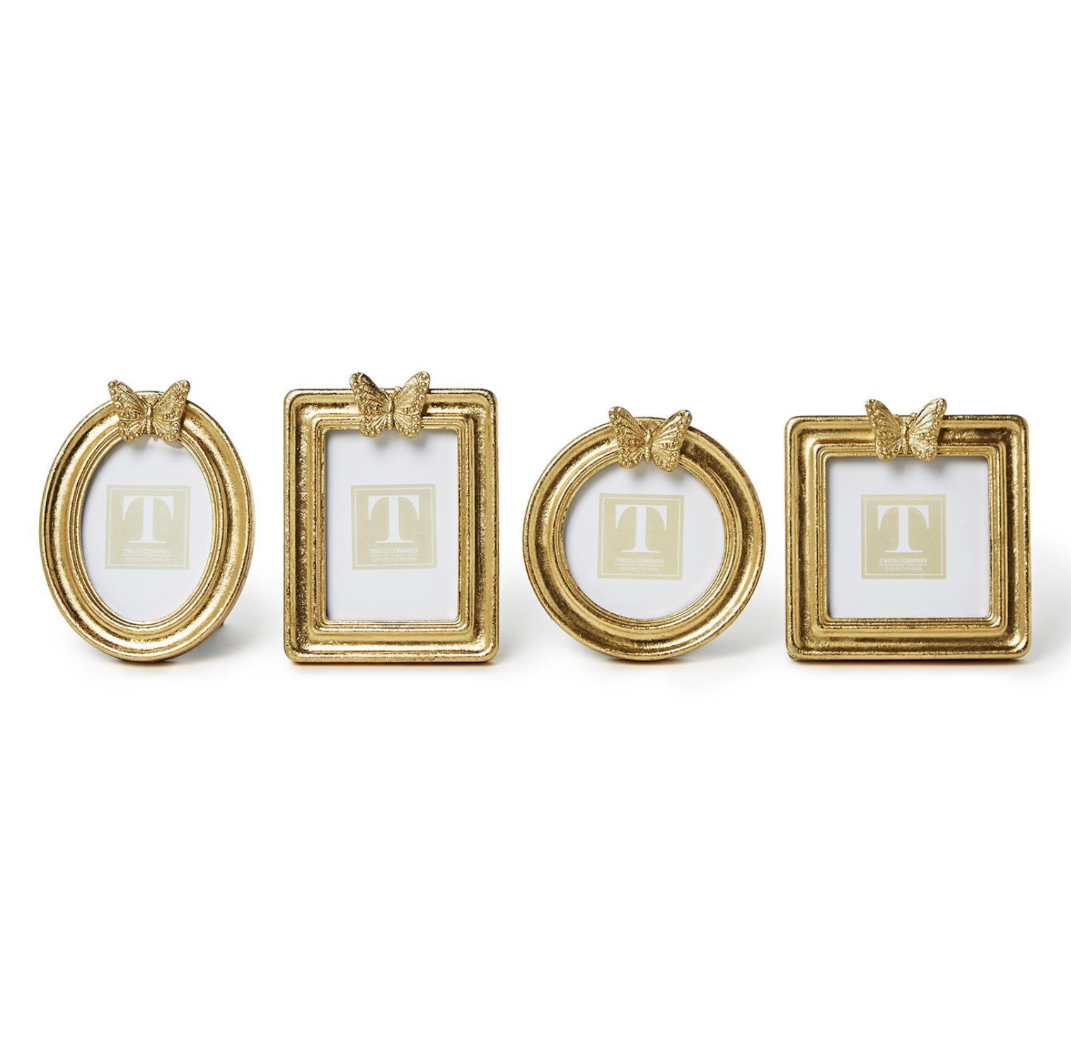 Set of four gold picture frames with decorative elements on a white background