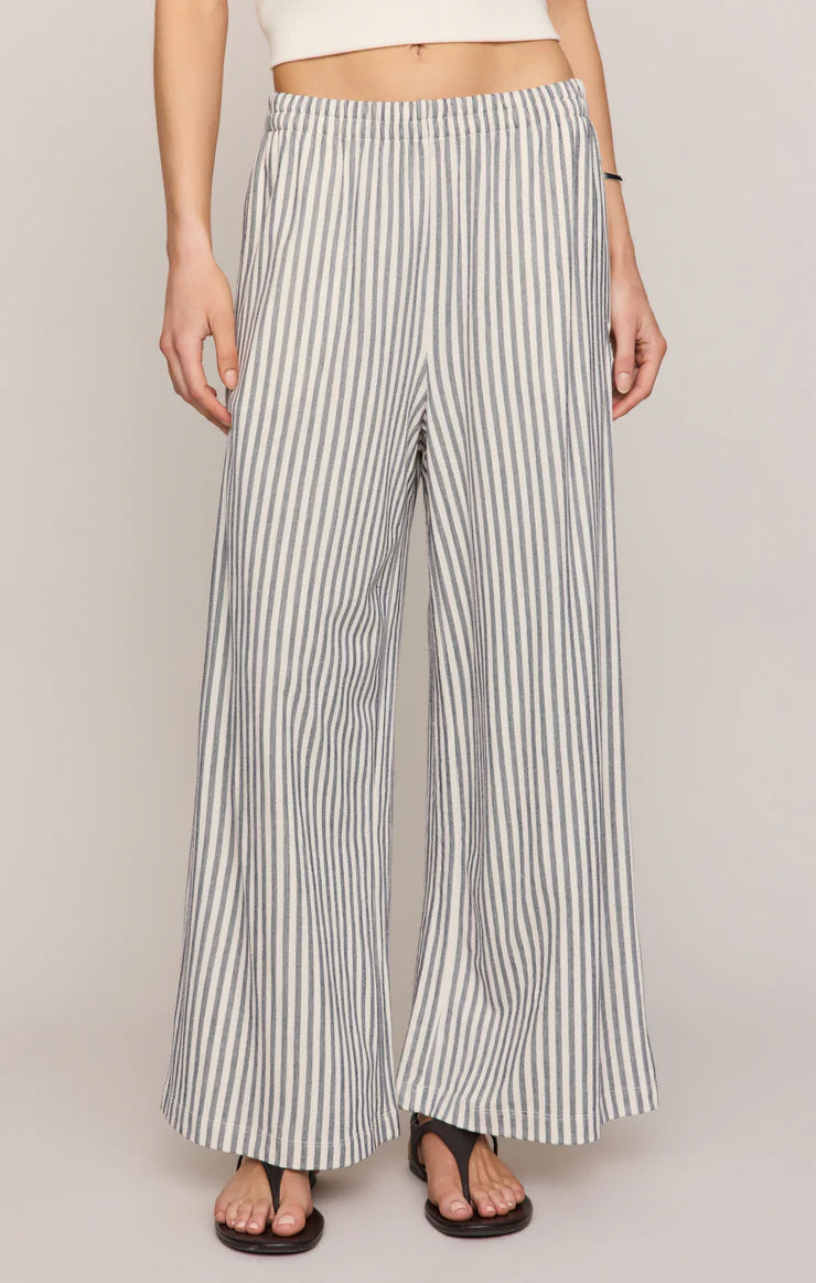 Striped wide-leg pants worn by a person on a plain background