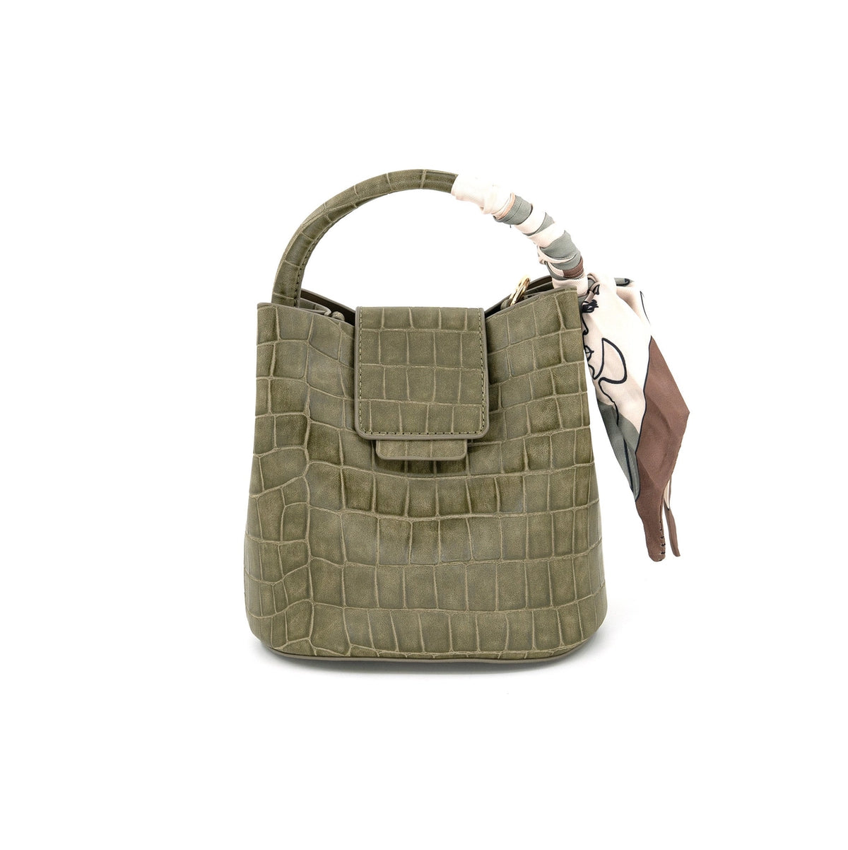 An olive green crocodile-embossed leather handbag with a top handle, a front flap pocket, and a patterned scarf tied to the side, shown on a plain white background.