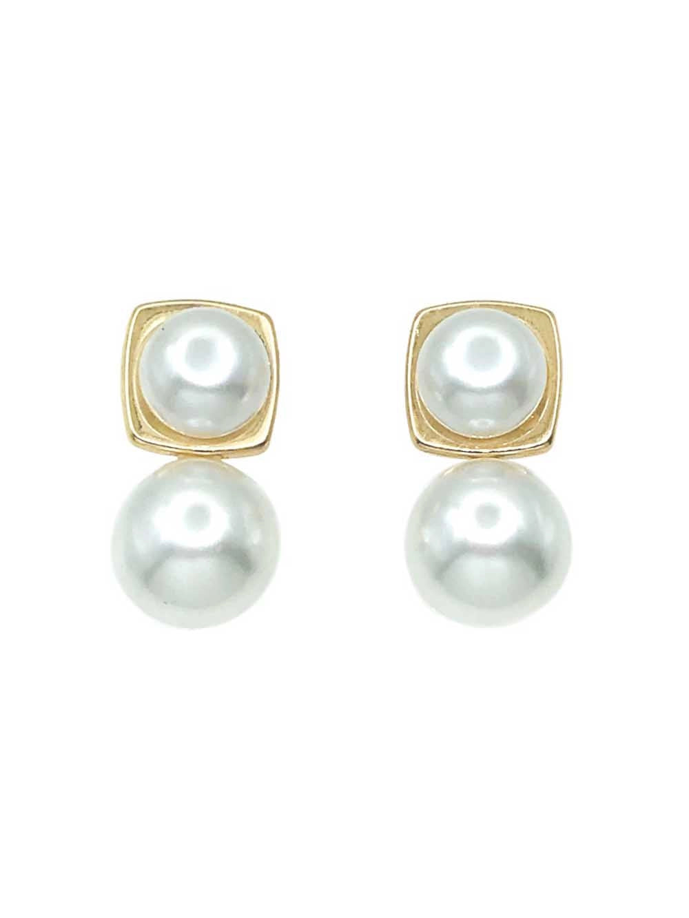 A pair of gold square stud earrings with round white freshwater pearls, displayed on a clean white background with a soft reflection below.