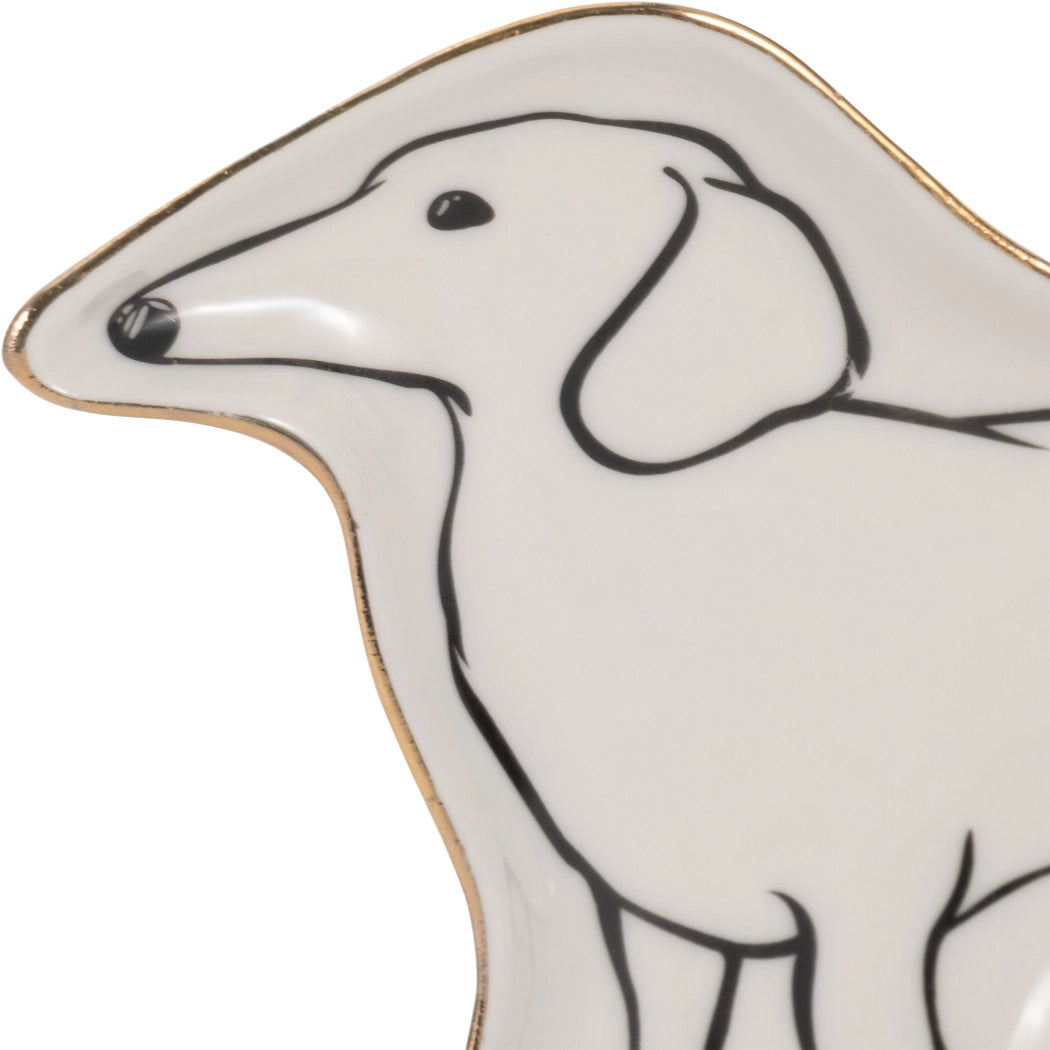 Dog-shaped ceramic plate with a black outline of a dog on a white background