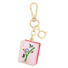 Mahjong keychain with pink book design and gold clasp on a white background