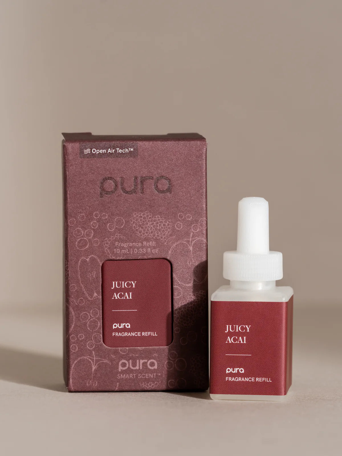 Pura Juicy Acai fragrance refill bottle and packaging on a beige background