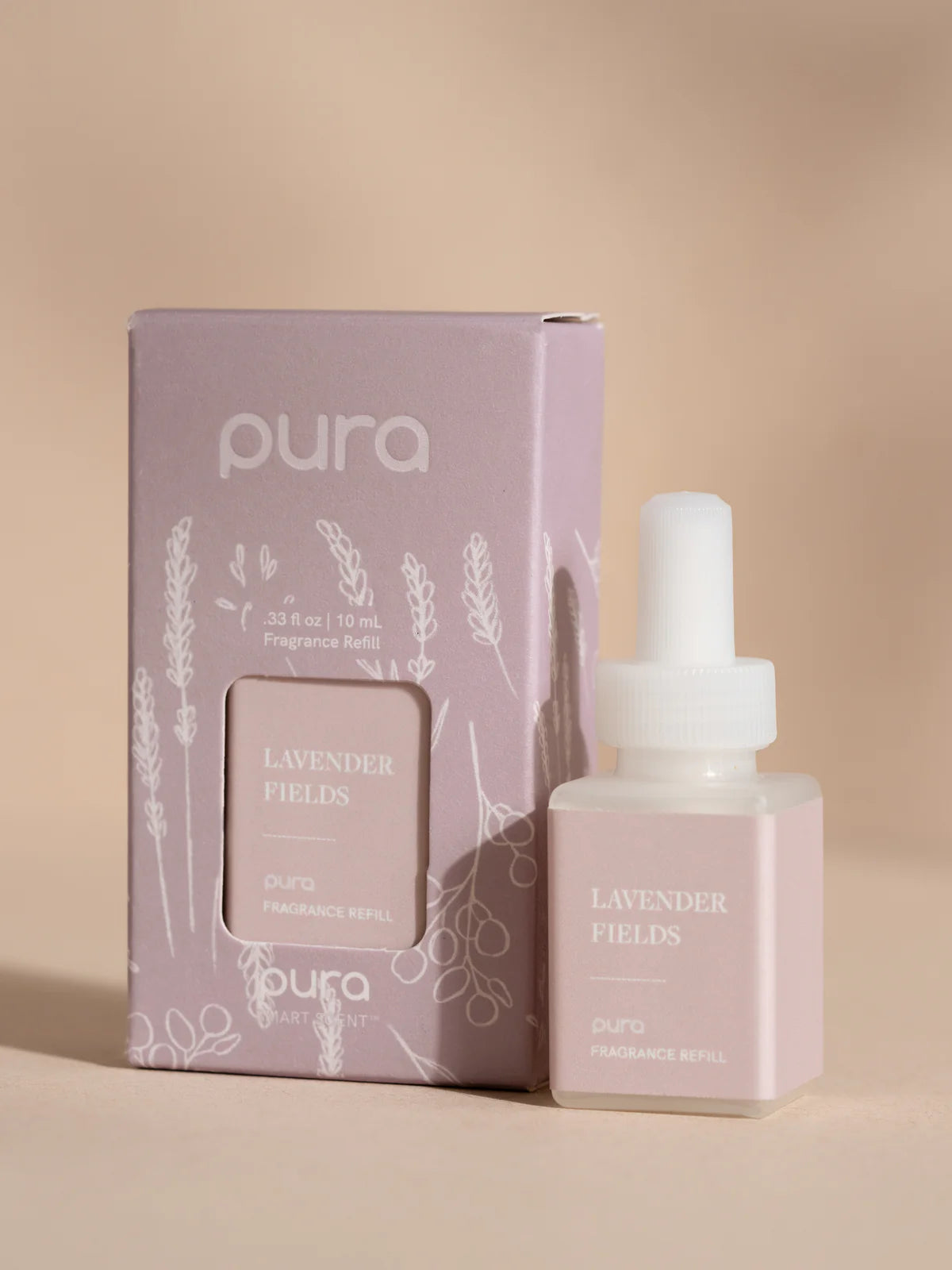 Pura Lavender Fields fragrance diffuser packaging and bottle on a beige background