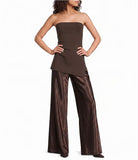 A woman modeling a dark brown strapless tube top paired with wide-leg metallic brown pants, posed against a plain white studio background.