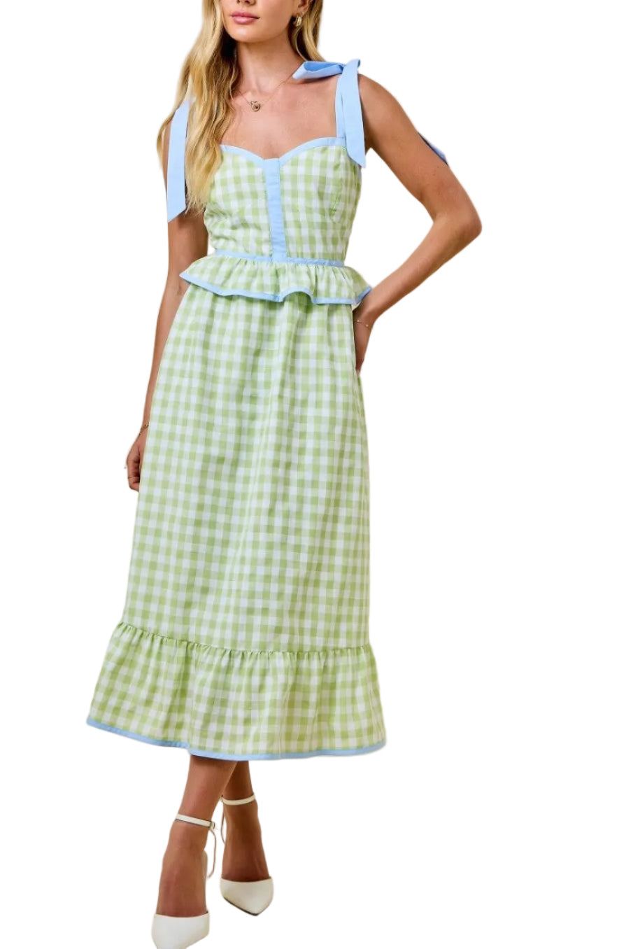 Woman wearing a green checkered dress with blue accents on a beige background