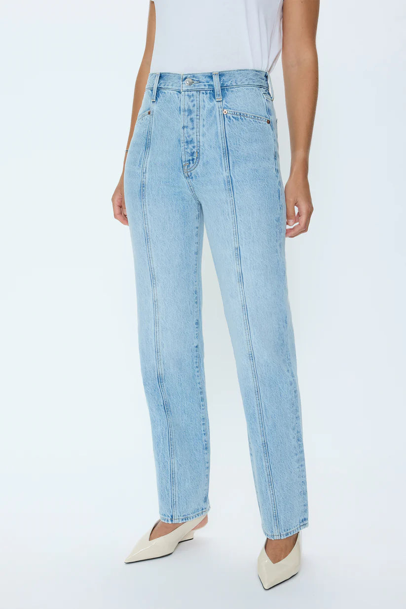 Light blue jeans worn by a person on a white background