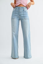 Light blue jeans worn by a person on a white background