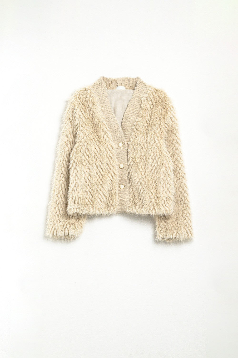 Beige knitted cardigan on a white background
