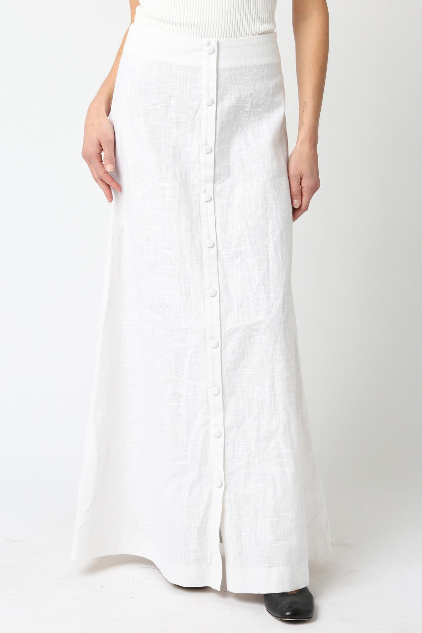 White wide-leg pants worn by a person on a white background