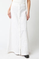 White wide-leg pants worn by a person on a white background