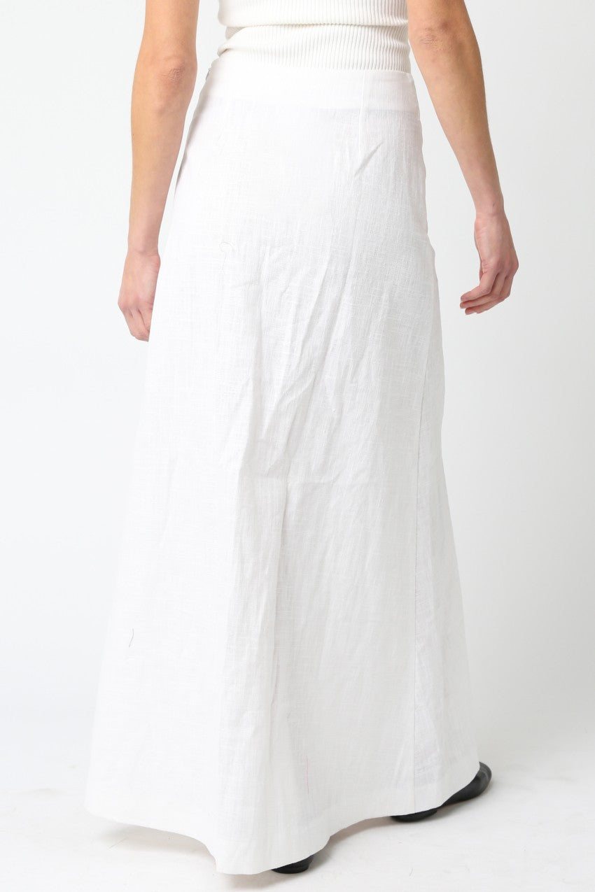 White skirt worn by a person on a white background