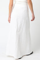 White skirt worn by a person on a white background