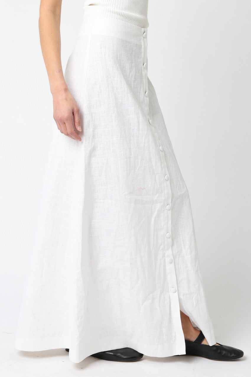 White dress with a slit on a white background