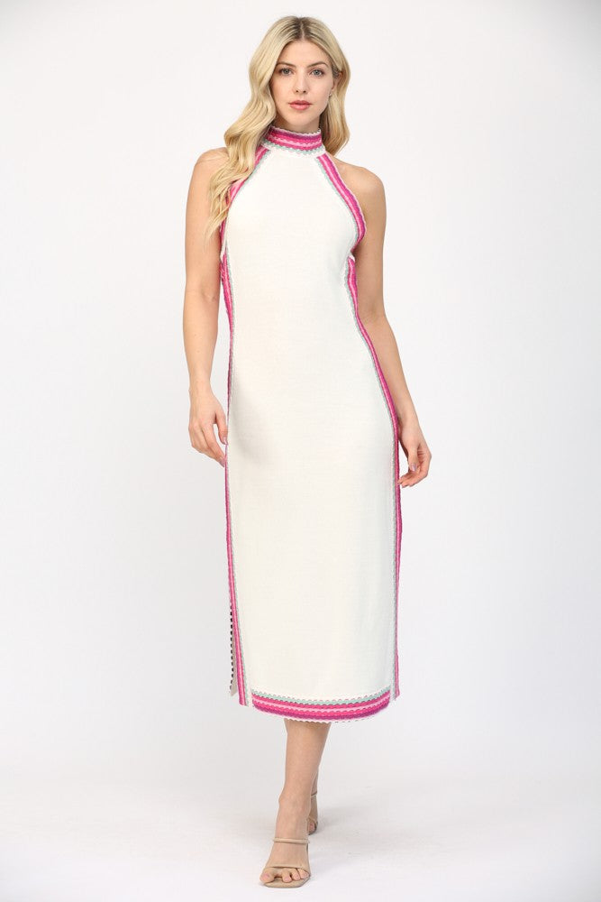 Woman wearing a white dress with pink trim on a white background