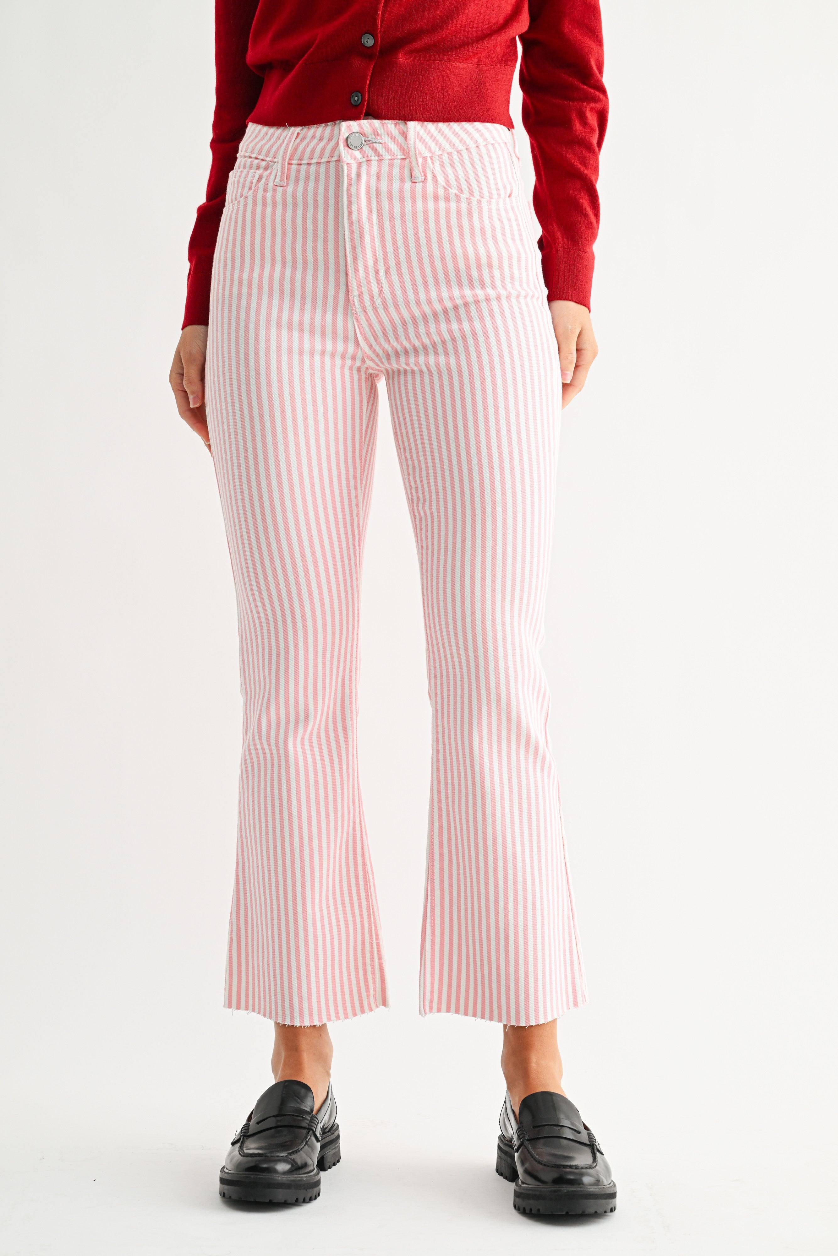 Person wearing red striped pants and a red top on a white background