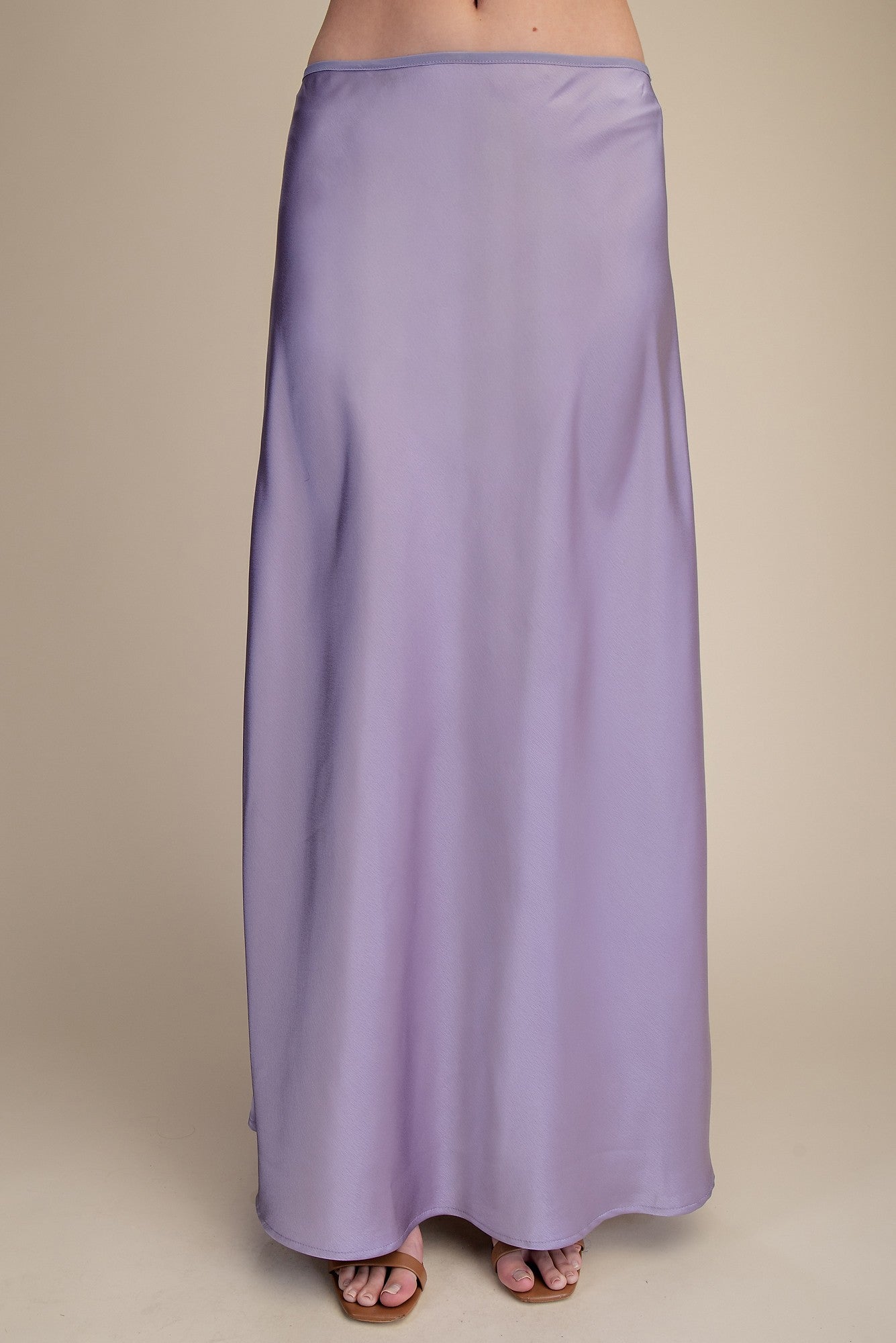Lavender maxi skirt on a beige background