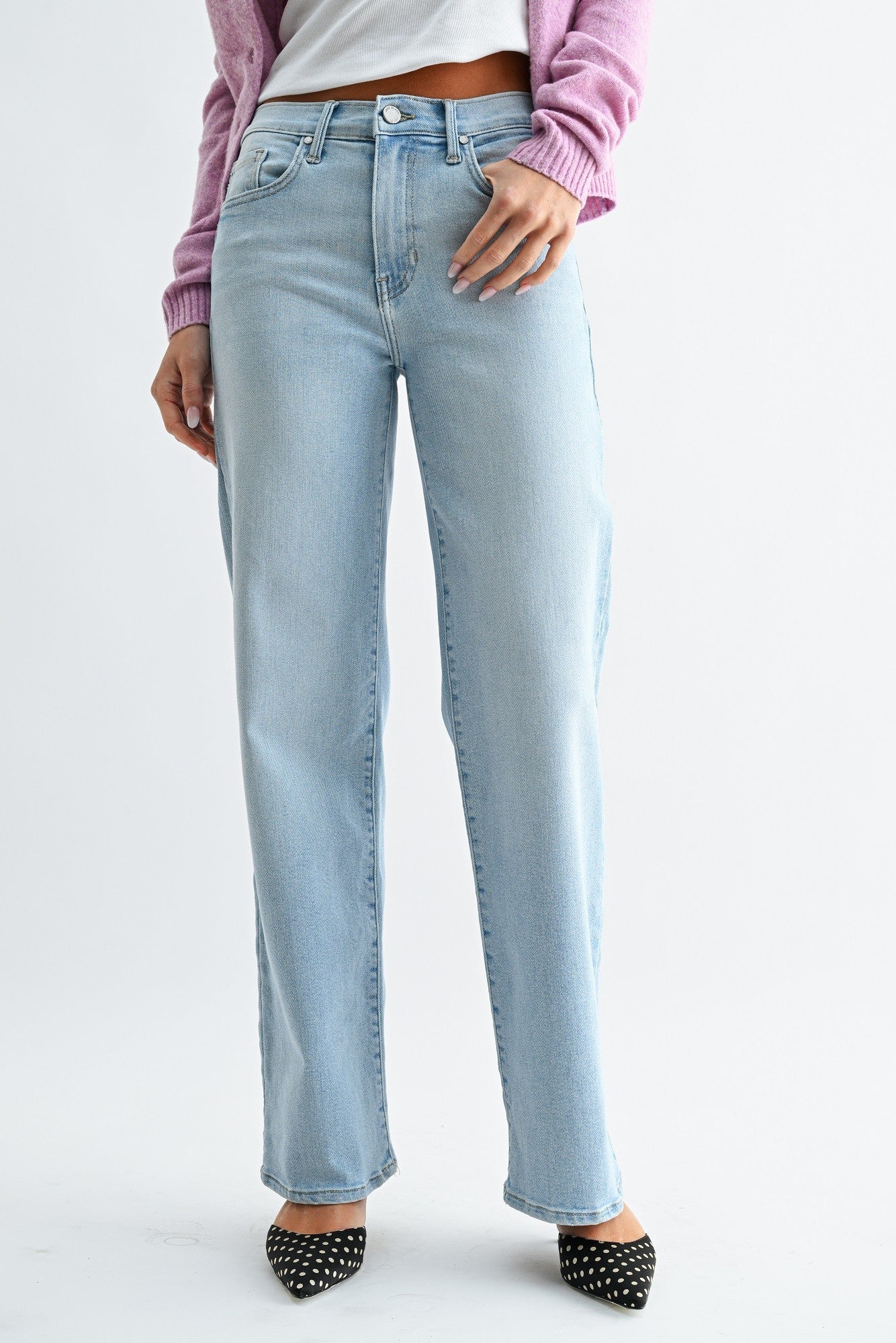 Light blue jeans worn by a person on a white background