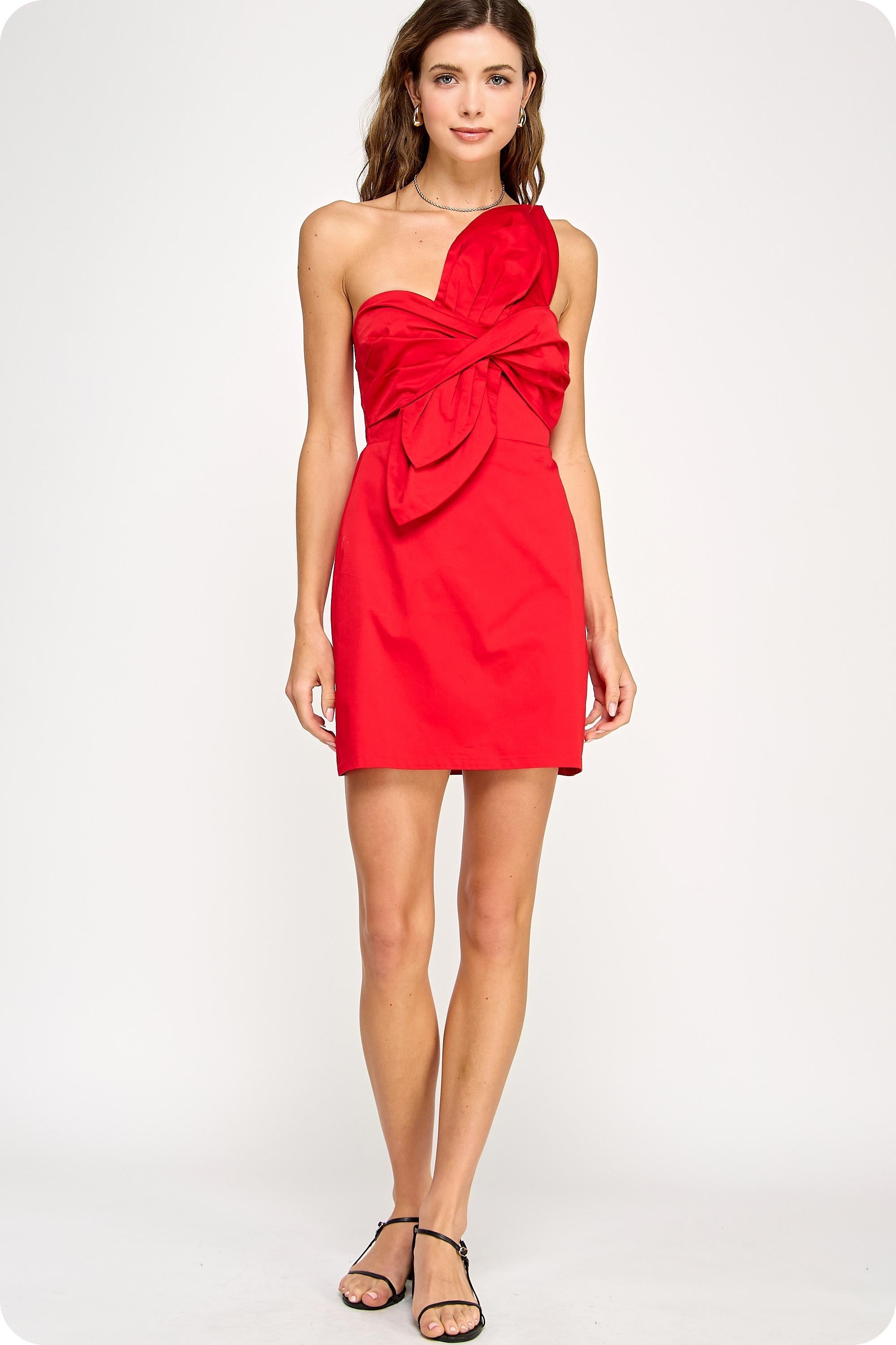 Red strapless dress with a bow detail on a white background