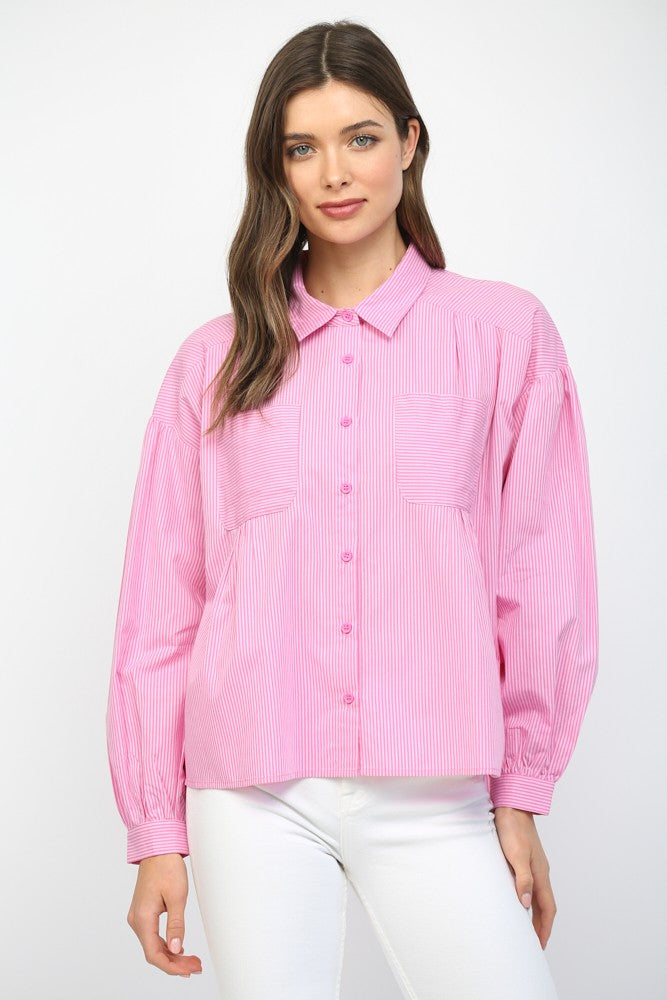 Woman wearing a pink striped shirt on a white background