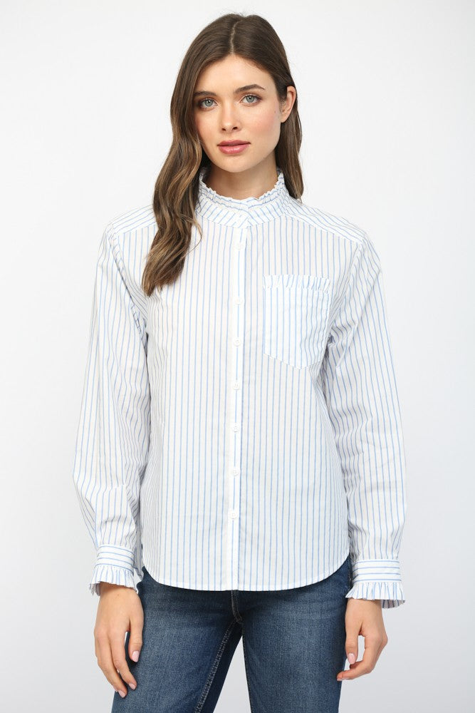 Woman wearing a white blouse with blue stripes and jeans on a white background