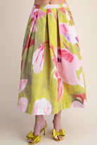 Floral skirt with pink and green flowers on a plain background