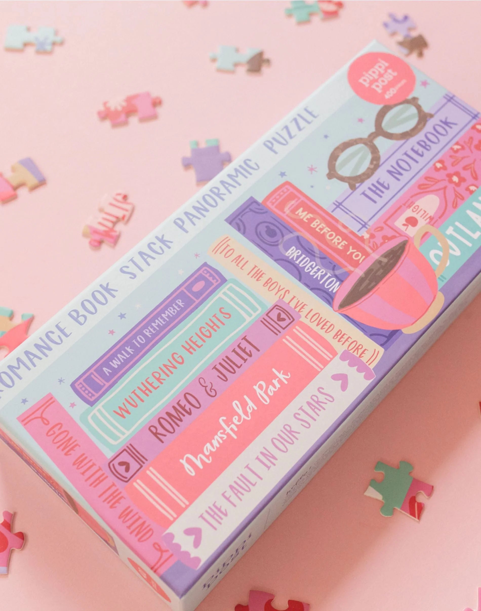Puzzle box with colorful design on a pink background with puzzle pieces.