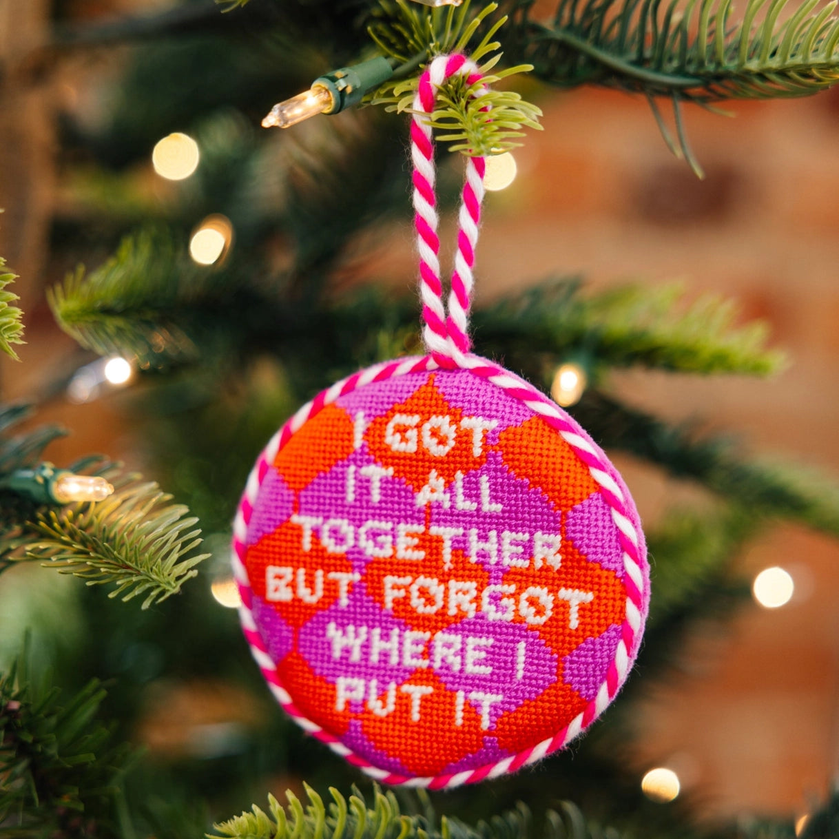 Decorative Christmas ornament with text on a tree