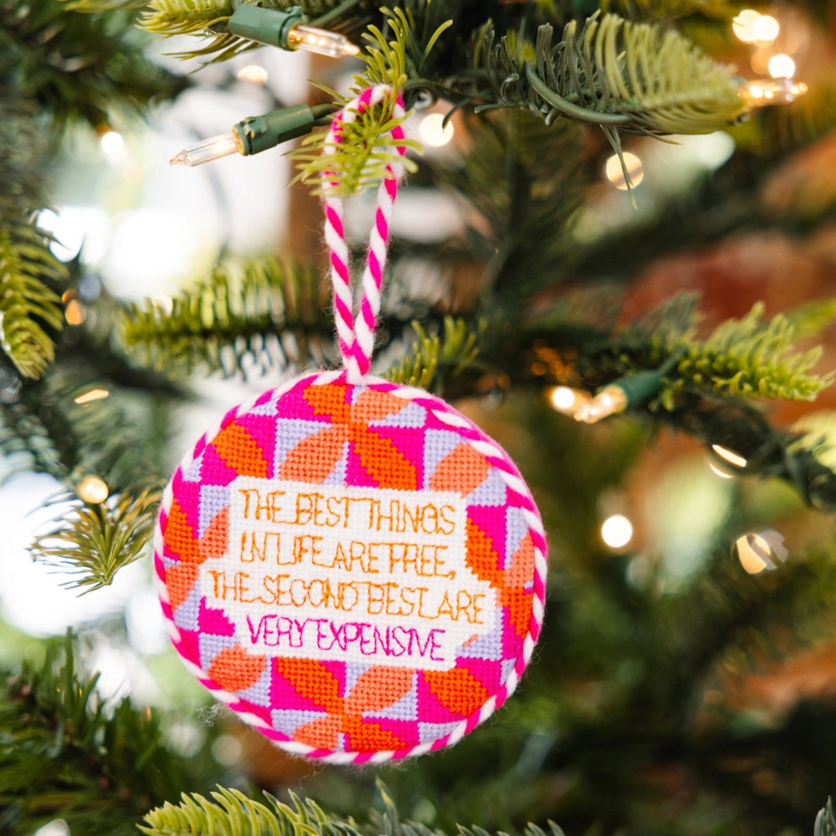 Decorative ornament with a quote on a Christmas tree