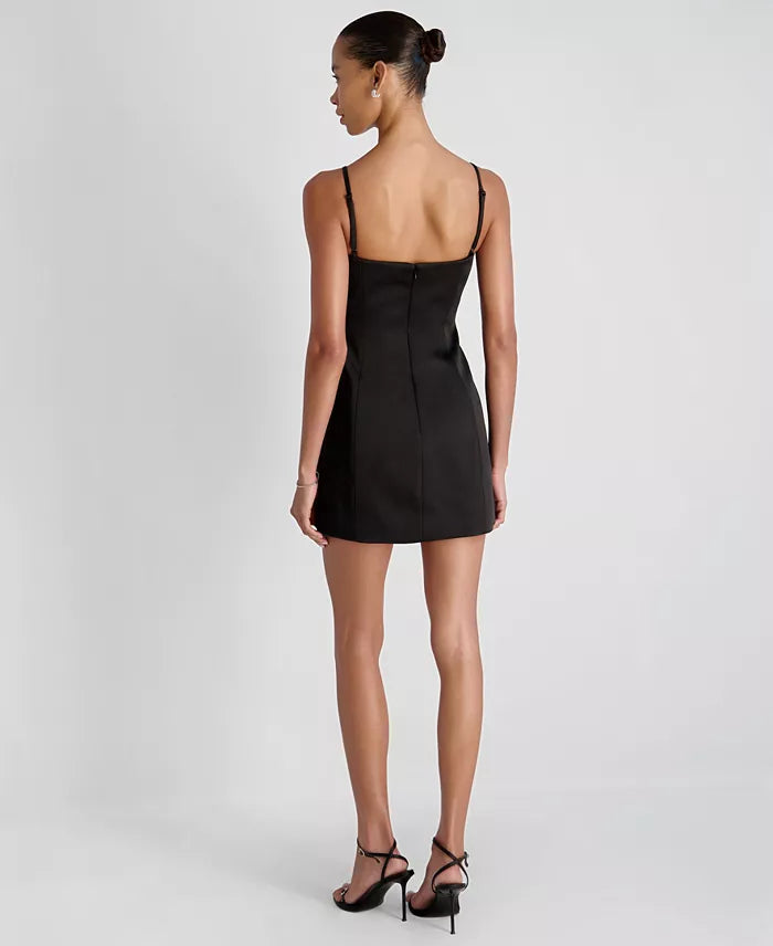 Woman wearing a black dress on a white background