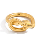 Gold knot ring on a white background
